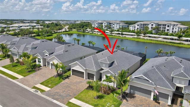 birds eye view of property with a water view