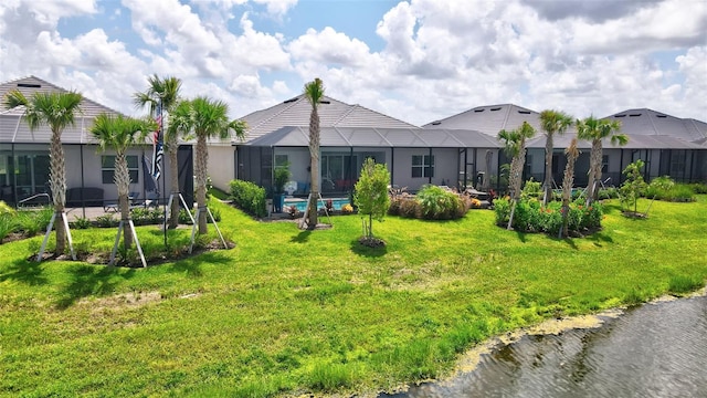 exterior space featuring a water view and glass enclosure