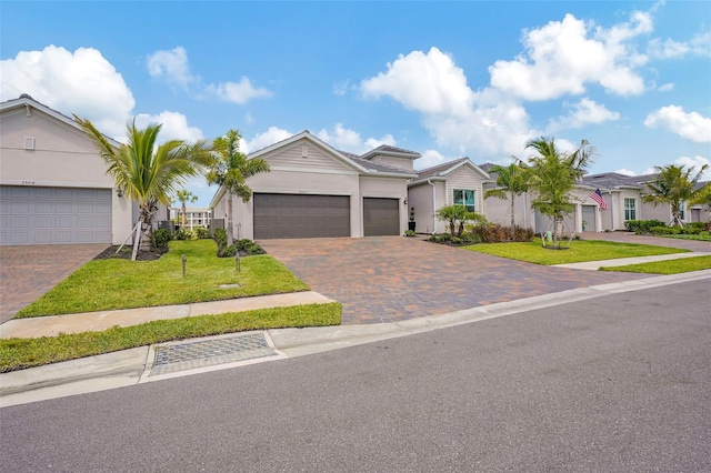 single story home with a garage and a front yard