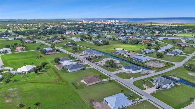 bird's eye view with a residential view and a water view