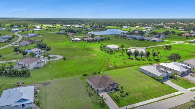 drone / aerial view with a water view and a residential view