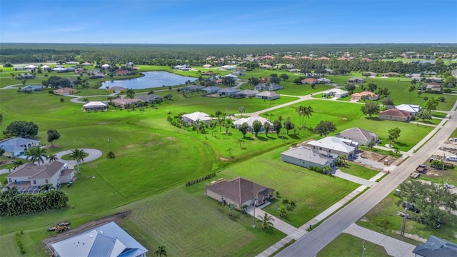 drone / aerial view featuring a water view and golf course view