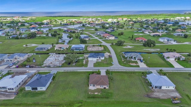 aerial view with a residential view and a water view