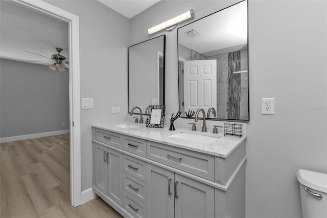 full bath featuring visible vents, a sink, toilet, and ceiling fan