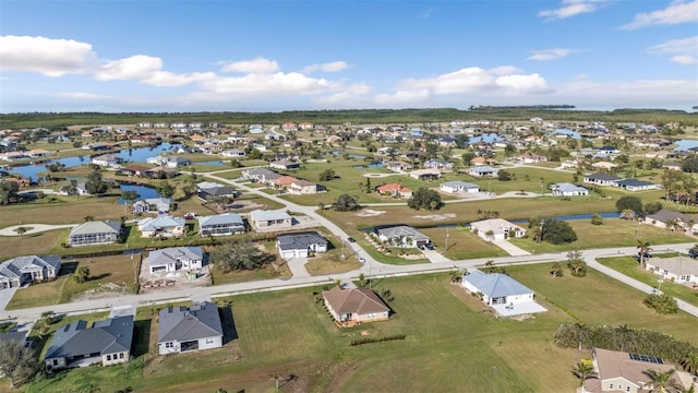 birds eye view of property featuring a water view and a residential view