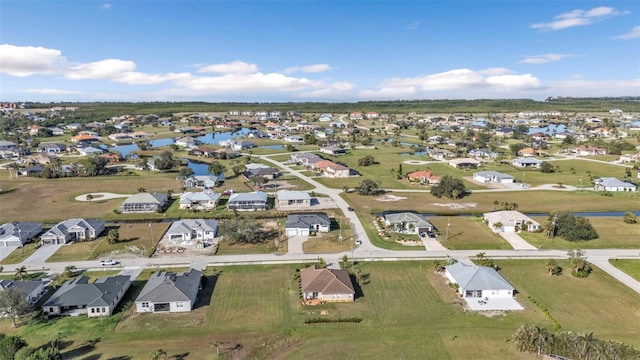 birds eye view of property with a residential view