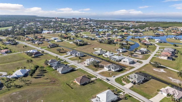 aerial view featuring a residential view and a water view