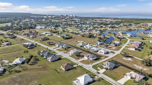 aerial view with a residential view and a water view