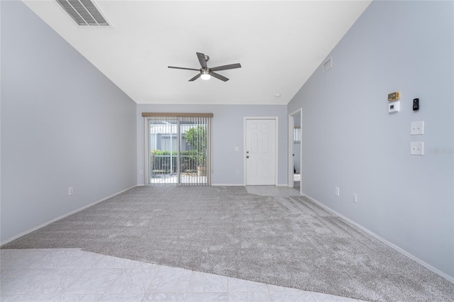 carpeted spare room featuring ceiling fan