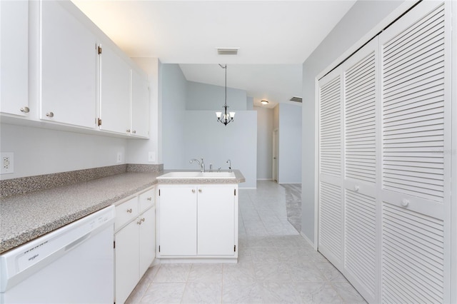 kitchen with sink, light tile patterned floors, dishwasher, and white cabinets