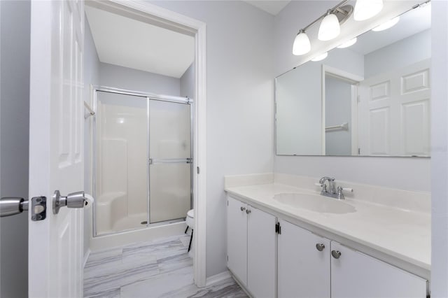 bathroom featuring vanity, an enclosed shower, tile patterned flooring, and toilet