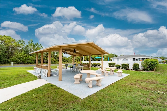 view of community featuring a yard and a patio area