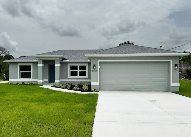 view of front of home featuring a garage and a front yard