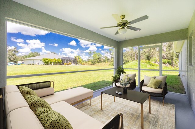 sunroom featuring ceiling fan