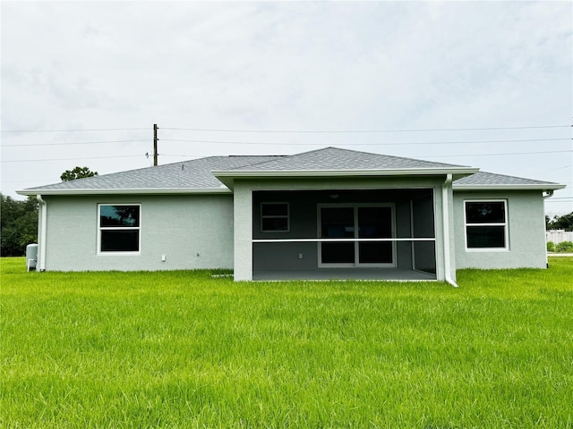 back of house with a yard