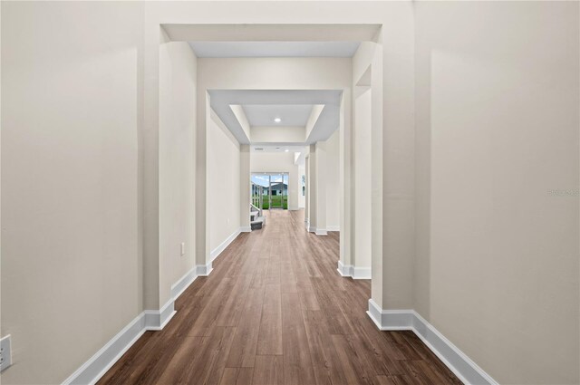 corridor featuring hardwood / wood-style floors