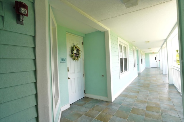 entrance to property featuring a porch