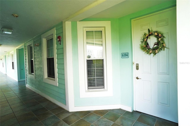 property entrance with covered porch