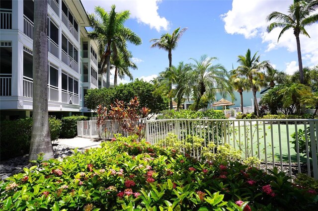 view of home's community with fence