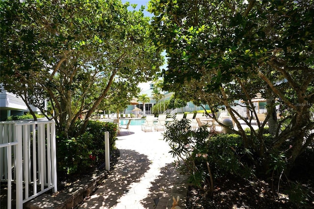 exterior space featuring fence and a pool