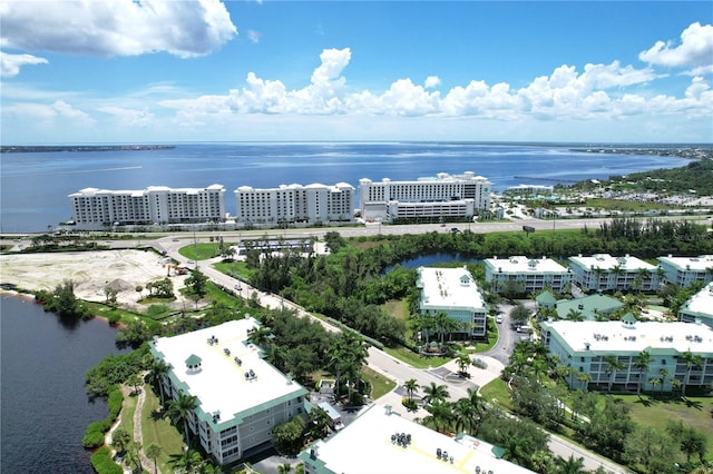 birds eye view of property featuring a water view