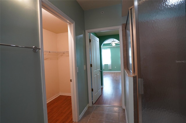 hallway with dark hardwood / wood-style flooring