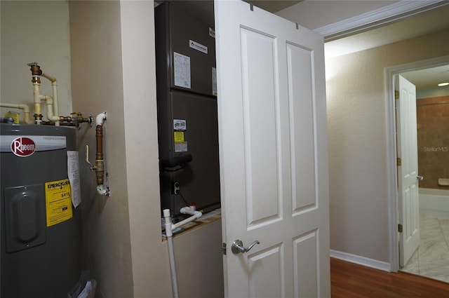 utility room featuring electric water heater