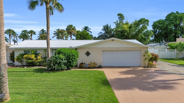 single story home featuring a front lawn and a garage