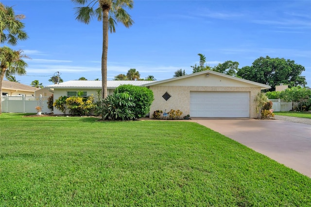 ranch-style house featuring a front yard and a garage