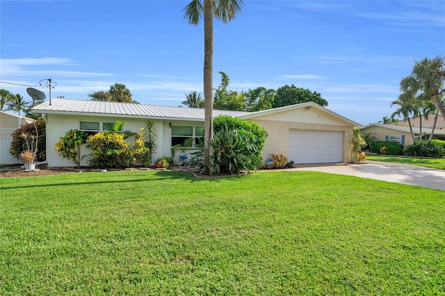 ranch-style home featuring a front lawn and a garage