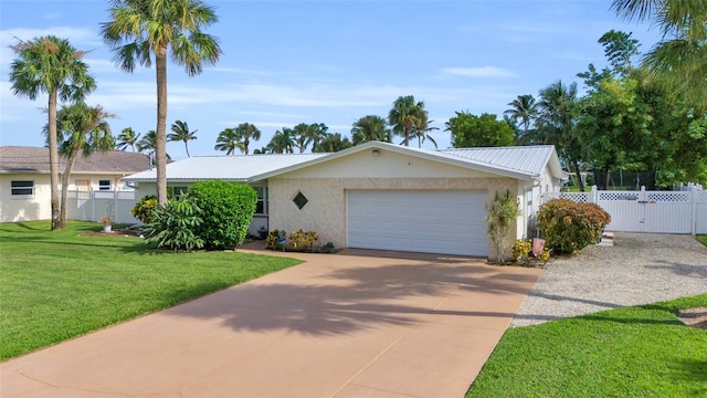 ranch-style home featuring a garage and a front lawn