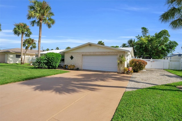 view of front facade with a front yard and a garage