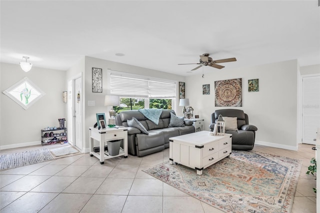 tiled living room featuring ceiling fan