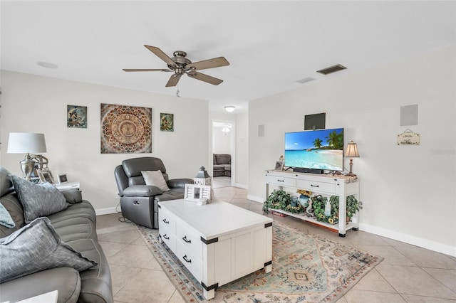 tiled living room featuring ceiling fan