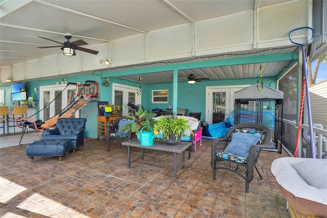 view of patio featuring french doors, ceiling fan, and an outdoor hangout area