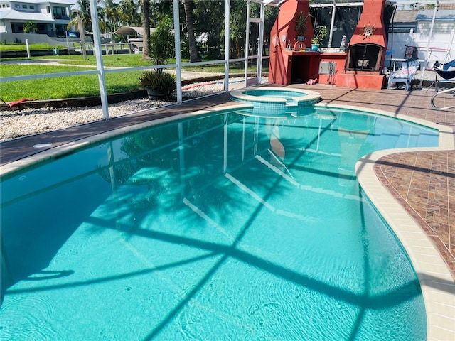 view of swimming pool featuring an in ground hot tub and glass enclosure