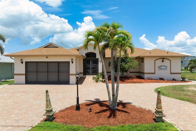 view of front of home with a garage