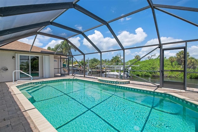 view of pool with a lanai, a patio area, and a jacuzzi