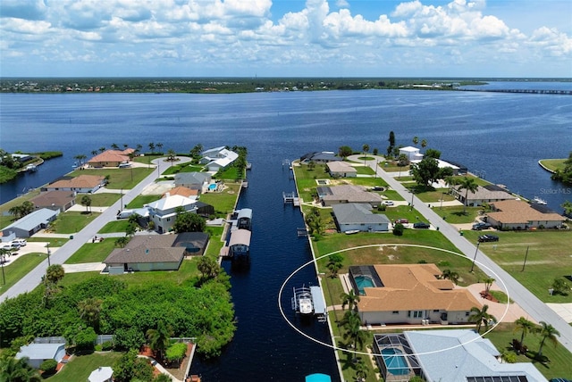 bird's eye view with a water view