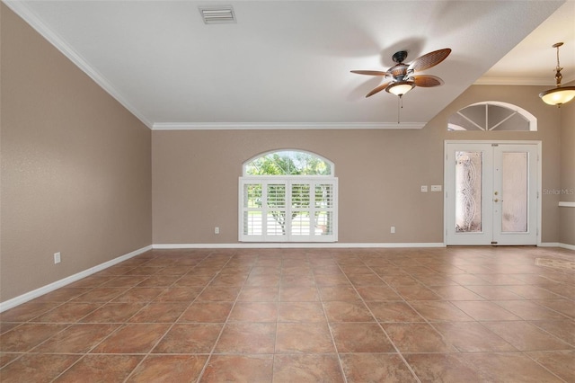 spare room with tile patterned floors, ornamental molding, and ceiling fan