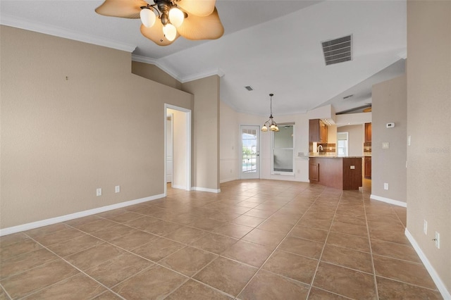 unfurnished living room featuring ornamental molding, lofted ceiling, ceiling fan with notable chandelier, and tile patterned floors