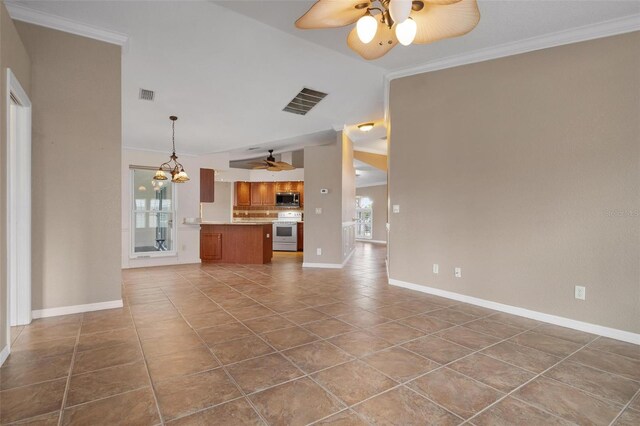 unfurnished living room with crown molding, ceiling fan with notable chandelier, and dark tile patterned flooring