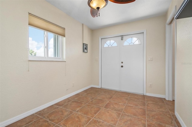 entrance foyer featuring ceiling fan