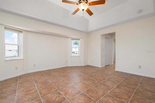 spare room featuring tile patterned flooring and ceiling fan