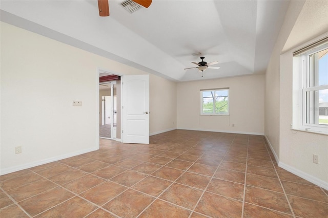 unfurnished room with tile patterned floors and ceiling fan