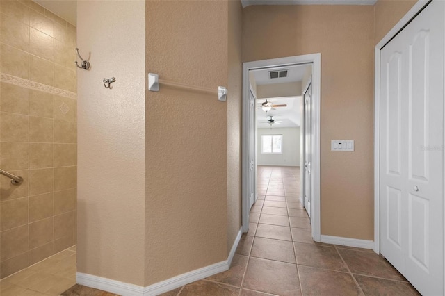 hall featuring tile patterned flooring