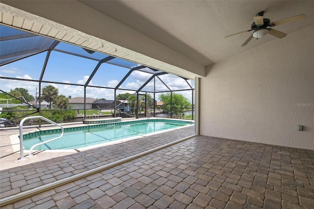 view of pool featuring a patio and glass enclosure