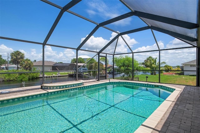 view of pool with a water view, a hot tub, a patio area, and glass enclosure