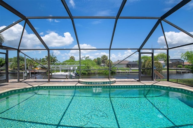 view of pool featuring a lanai and a water view