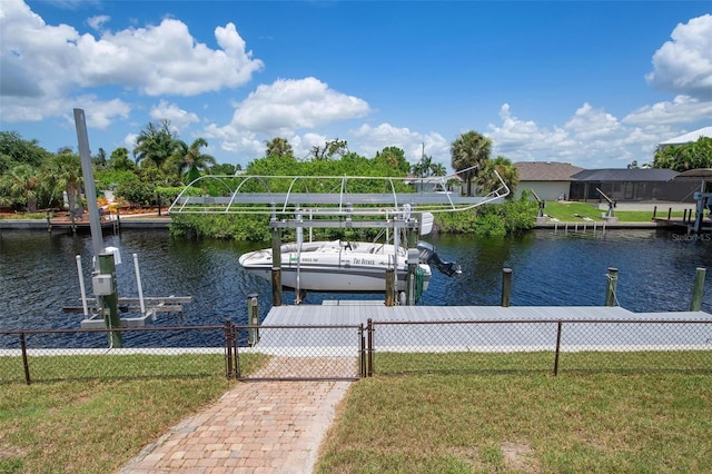 dock area with a water view and a lawn